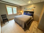 Lower level bedroom 4 with queen bed